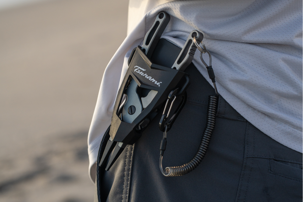 Multi-tool attached to a person's pocket with a blurred background