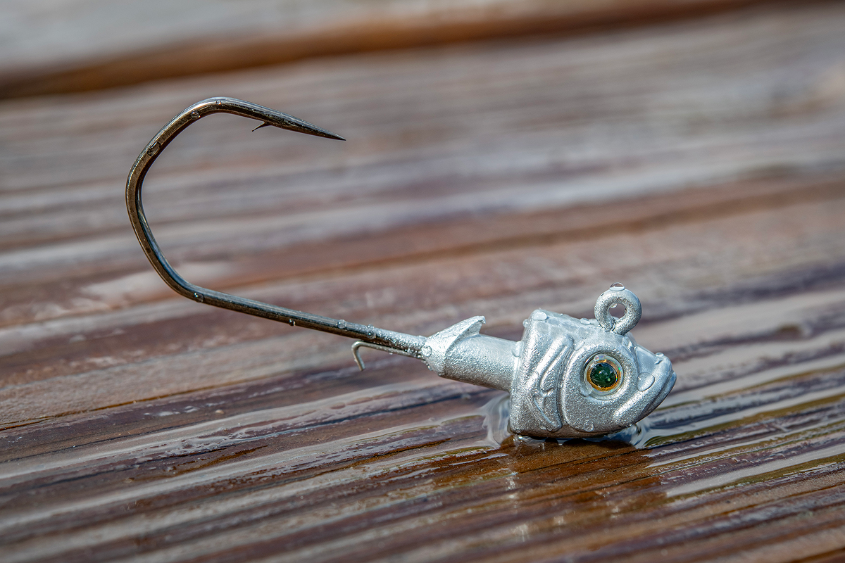 Fishing lure with a hook on a wooden surface